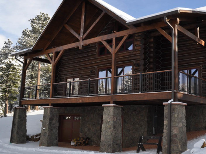 Timber Frame Log Cabin Exterior in Snow