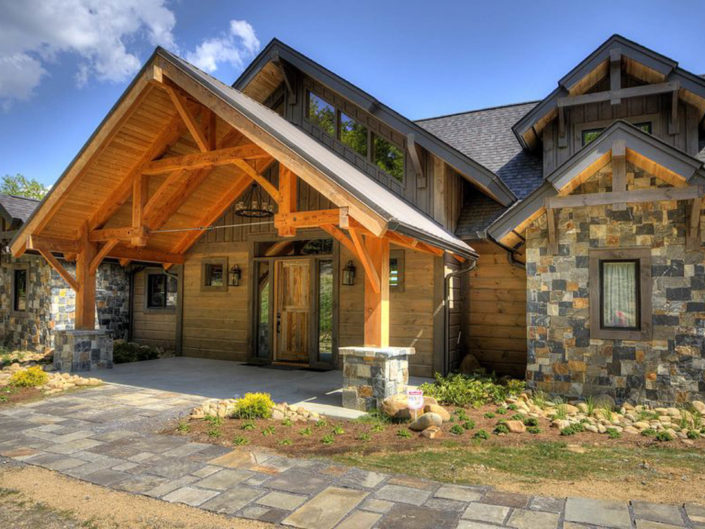 Timber Frame Home Entryway with Hammerbeam Truss