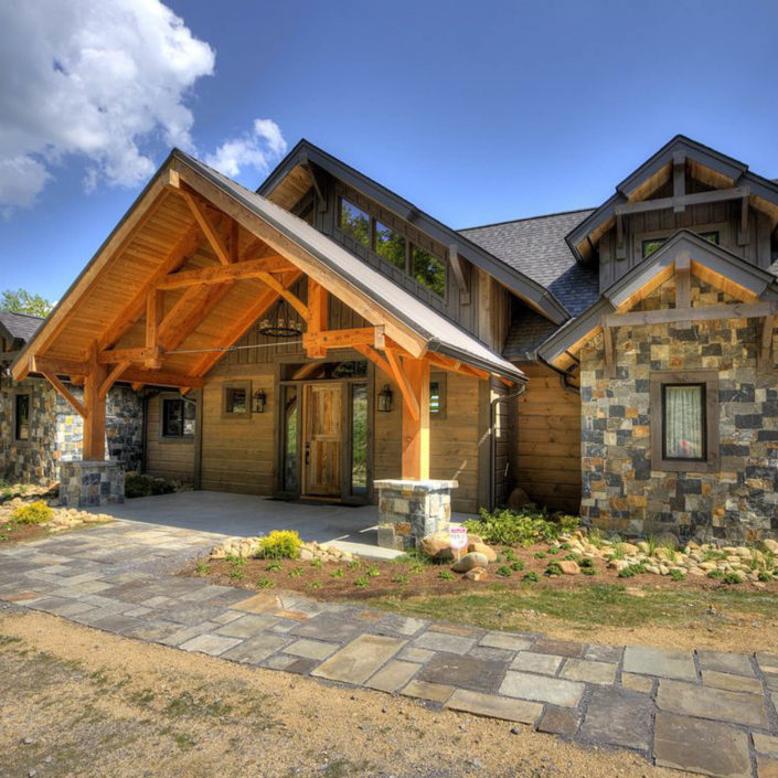 Timber Frame Home Entryway with Hammerbeam Truss